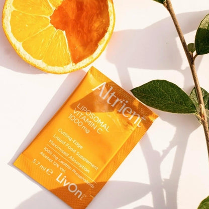 Altrient Liposomal Vitamin C supplement packaging with an orange slice and leaves on a white background