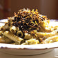 Pasta dish with Seagreens Pelvetia Pieces on a white plate