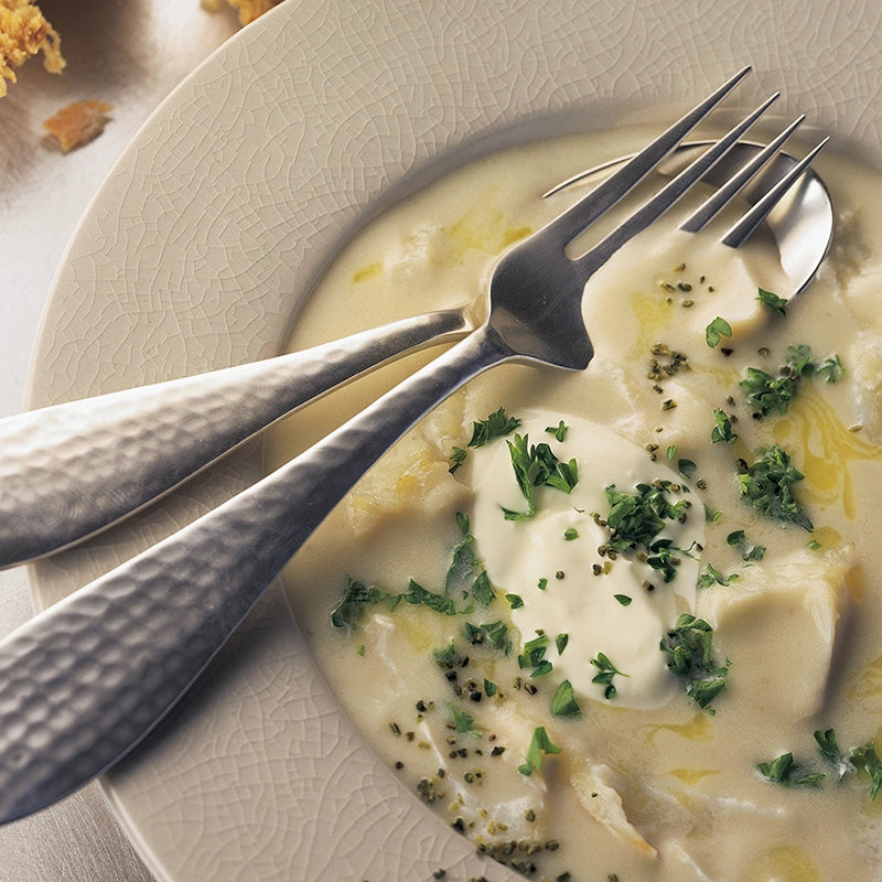 Plate of food with Seagreens Culinary ingredients, a fork and knife on a plate